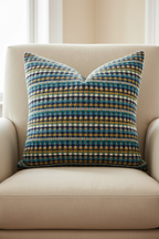 Multicolored Woven Pillow on Linen Chair - Zoomed Out